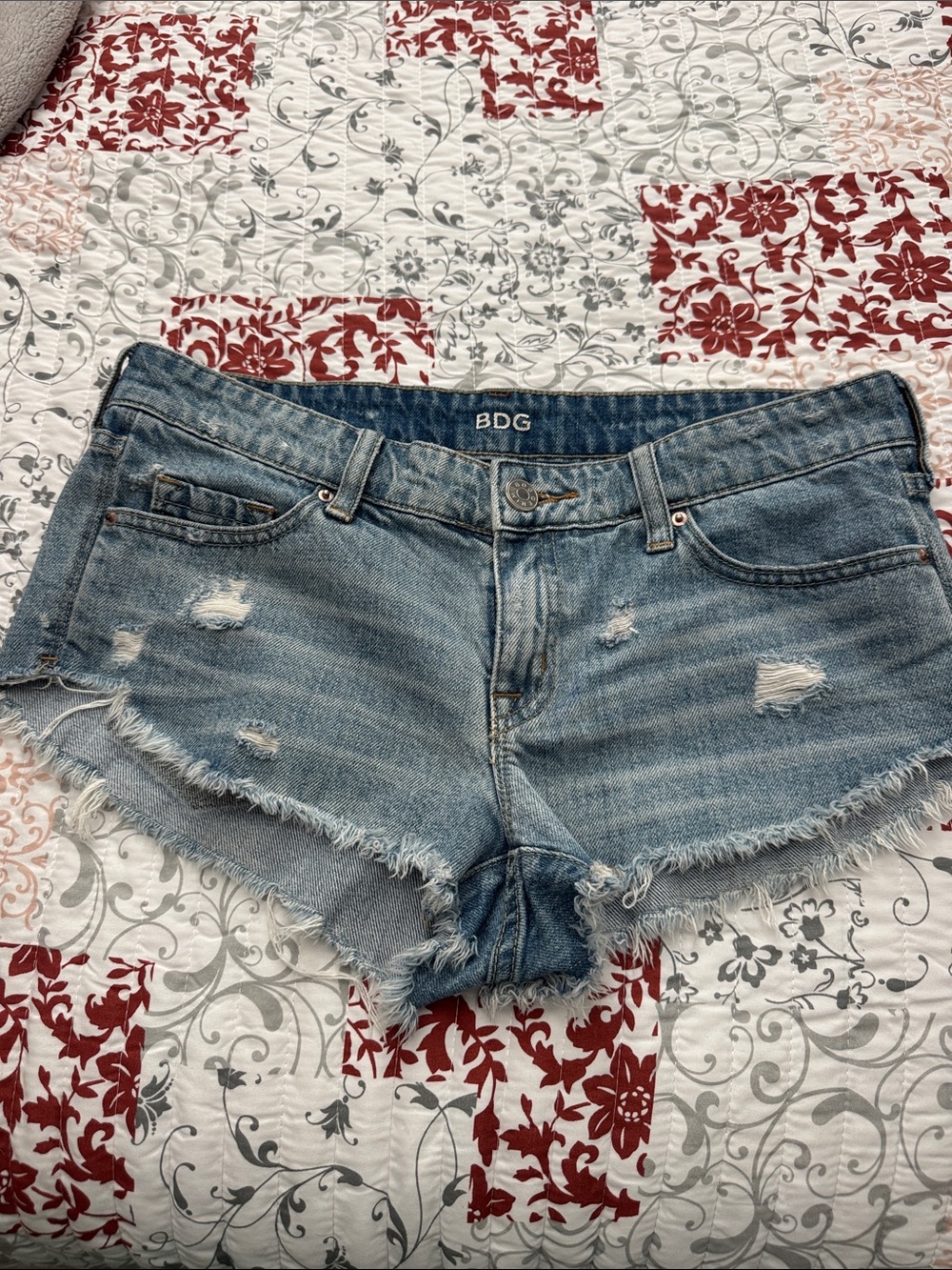 BDG low rise dolphin Light Blue Distressed Cutoff Jean Shorts